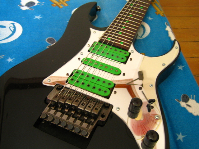 Ibanez UV7BK Black with Green Dots.jpg